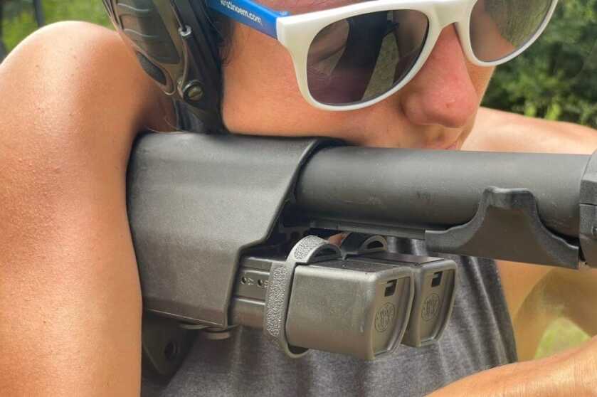 Folding 9mm Carbine! Smith & Wesson M&P FPC Reviewed The double mag carrier integrated in the stock with the quick release locking mechanism sticking up from the bottom