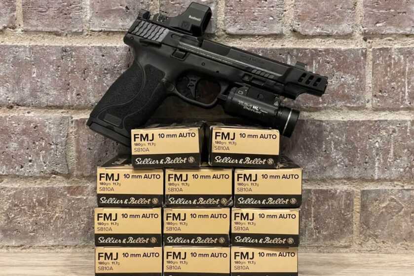 2 - S&W Performance Center 10mm M2.0 Pistol: Put to the Test Smith & Wesson Performance Center 10mm M2.0 sitting on a pile of ammo