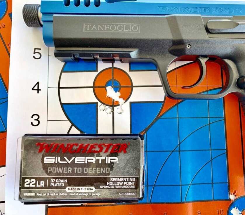 Tangfolio Force 22 TB with Winchester Silvertip ammo on a blue and orange target