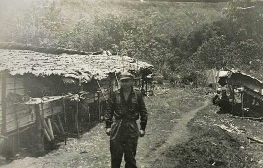 Old photograph of Tom Harnett Harrisson standing in the Japanese jungle of Borneo