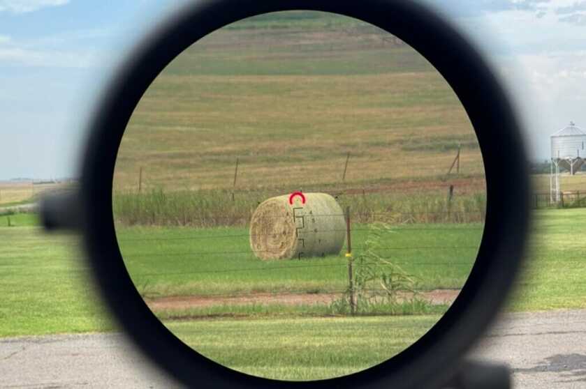 Looking through the Arken EP-8 reticle at a hay bale