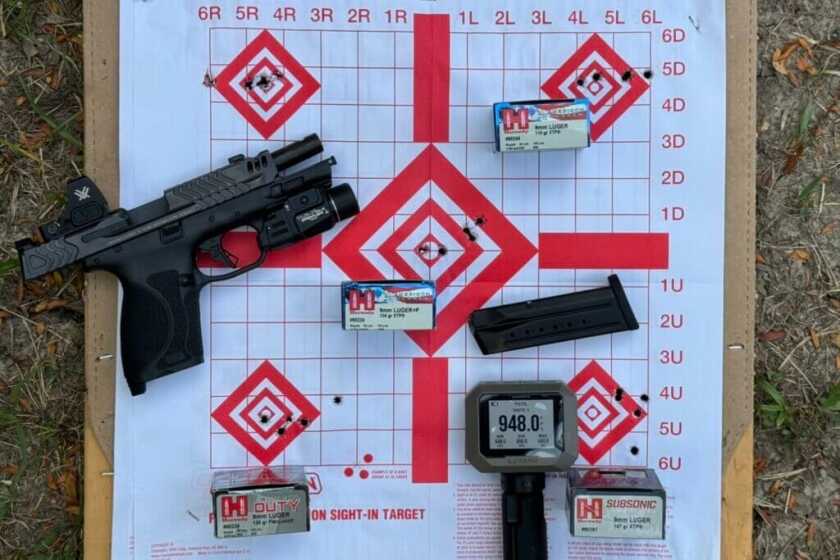 Smith & Wesson M2.0 Carry Comp with paper target and Hornady ammunition boxes