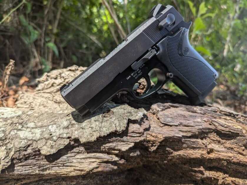 S&W third-generation handgun, the 457 on rugged piece of wood