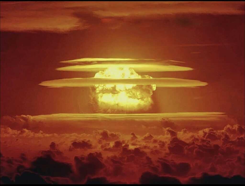 Nuclear Cloud in an orange sky above clouds
