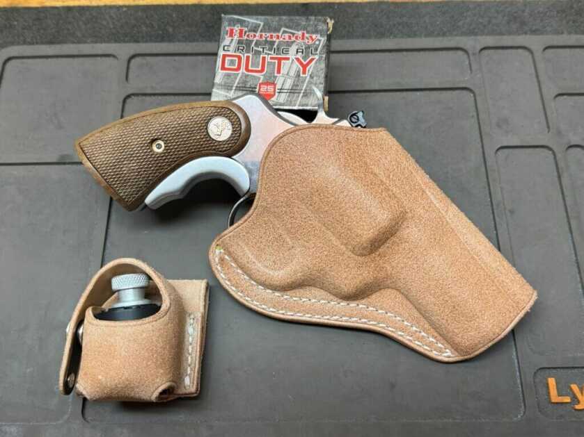 Colt Python revolver with leather holster