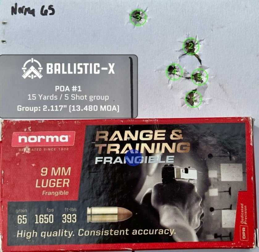 A used pistol target with a box of ammunition on top shows how accurate it is.