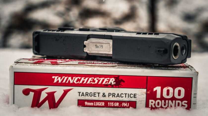 GX2 on top of a box of Winchester Ammunition.