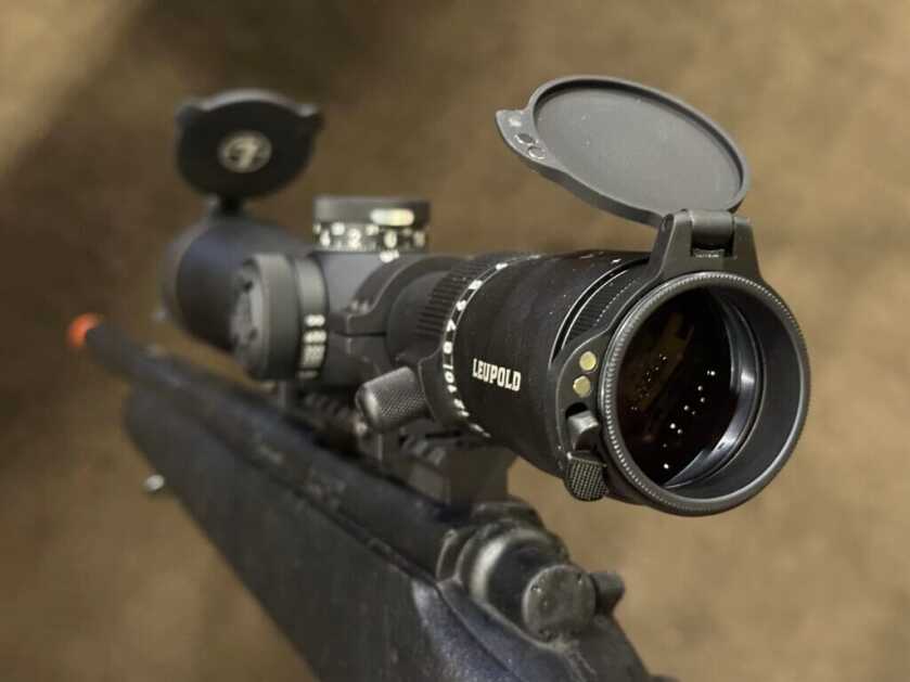 Closeup of a rifle scope from the ocular lens side.