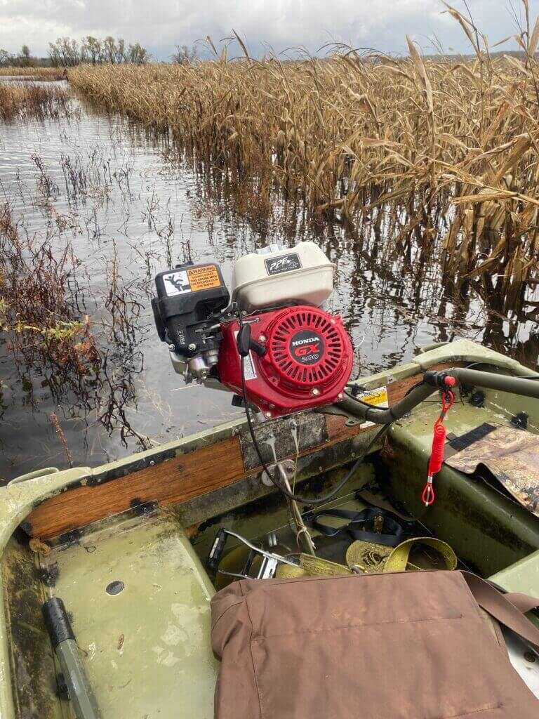 Honda GX200 6.5 HP on PPF Wood Duck mud motor rotated for storage in marsh-ready duck boat