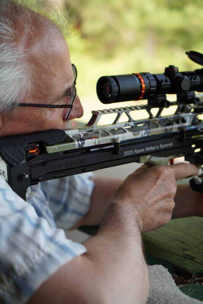 man shooting crossbow