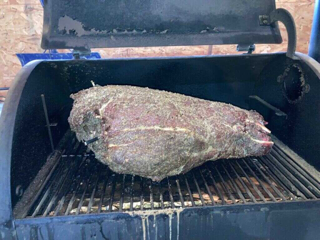 Whole rear elk quarter smoking on Traeger at 225 degrees for 6 hours