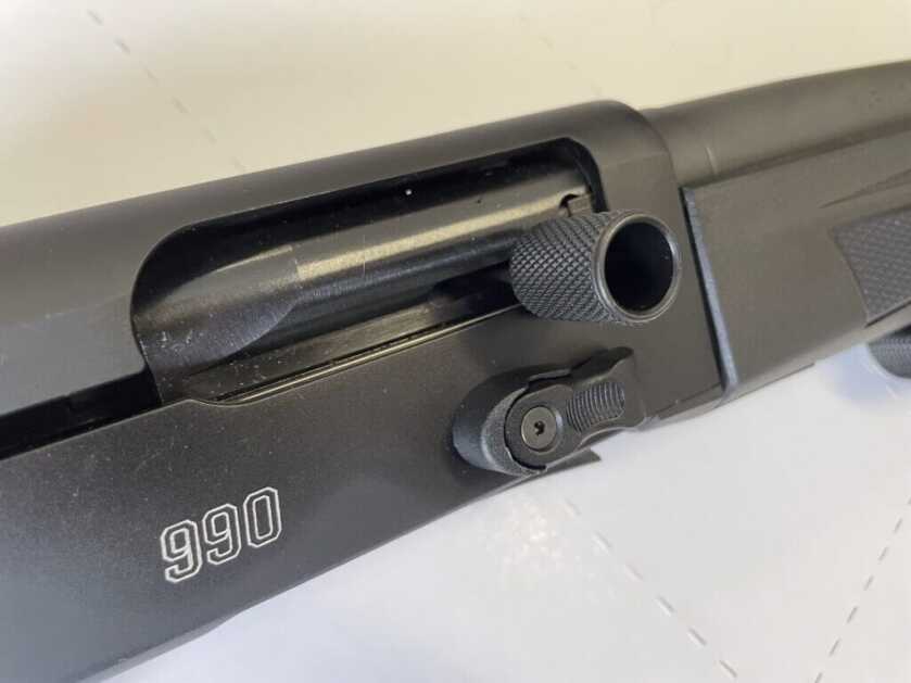 Mossberg 990 Aftershock oversized bolt release and charging handle closeup